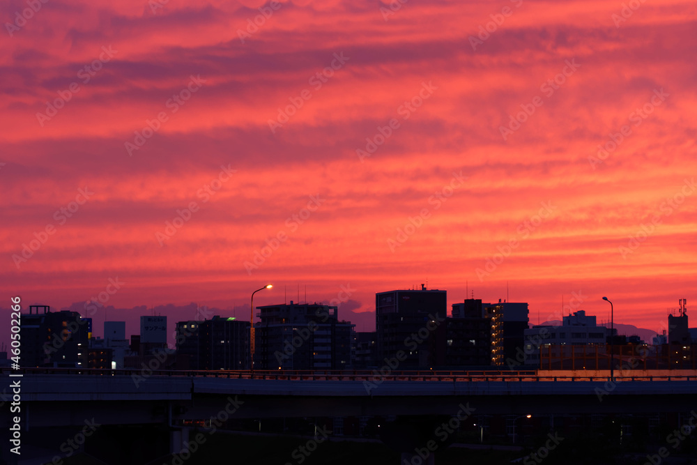 cityscape with bypass bridge under red sky cityscape with bypass bridge under red sky