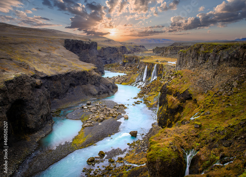 Beautiful sunset and landscape of Sigoldugljufur canyon with many small waterfalls and the blue river in Highlands of Iceland