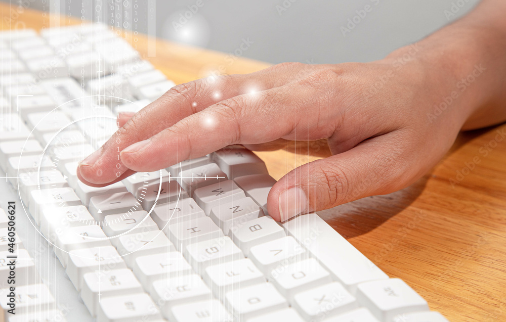Female office worker typing on the keyboard
