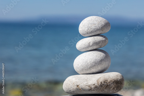 Zen balance stones  smooth pebbles pyramid stacked on the seashore