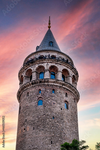 The Galata Tower in Beyoglu neighborhood of Istanbul, Turkey at golden hour.