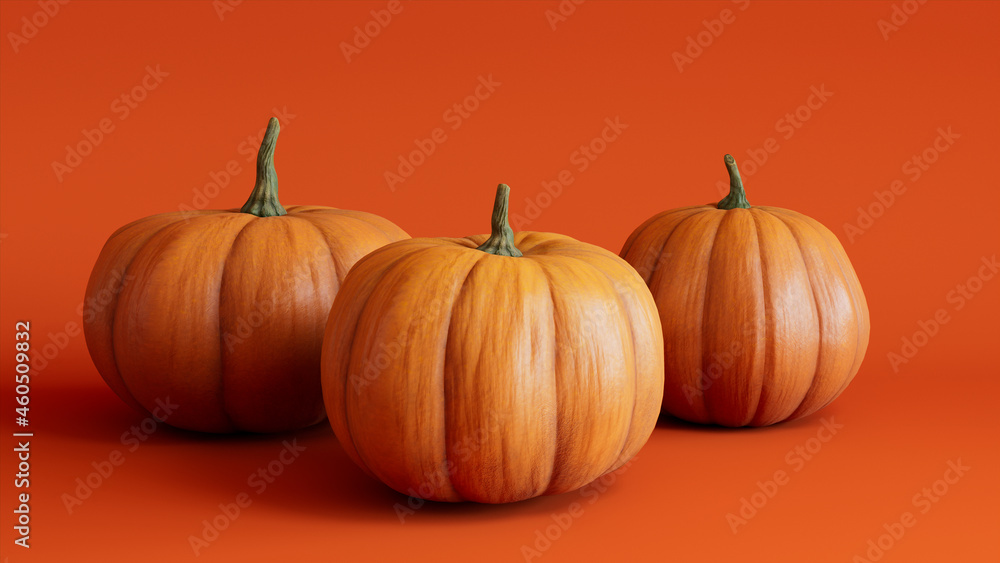 Seasonal background Image. Trio of Pumpkins on Orange color. Fall Concept.
