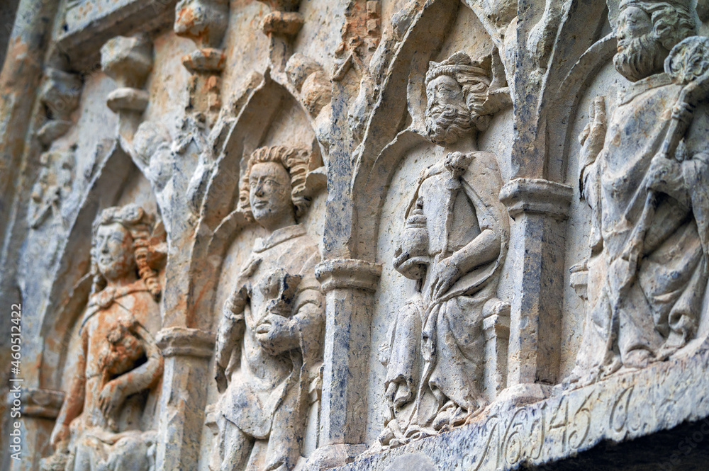 Obraz premium Tympanum at the main entrance of the Wittenberg Town Church. Close-up with the holy helpers Saint Dorothy of Caesarea, Saint John the Apostle, Saint Sigismund of Burgundy, Saint Nicholas of Myra (LTR)