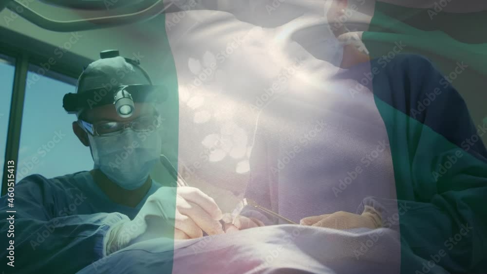 Animation of flag of nigeria waving over surgeons in operating theatre Animation of flag of nigeria waving over surgeons in operating theatre