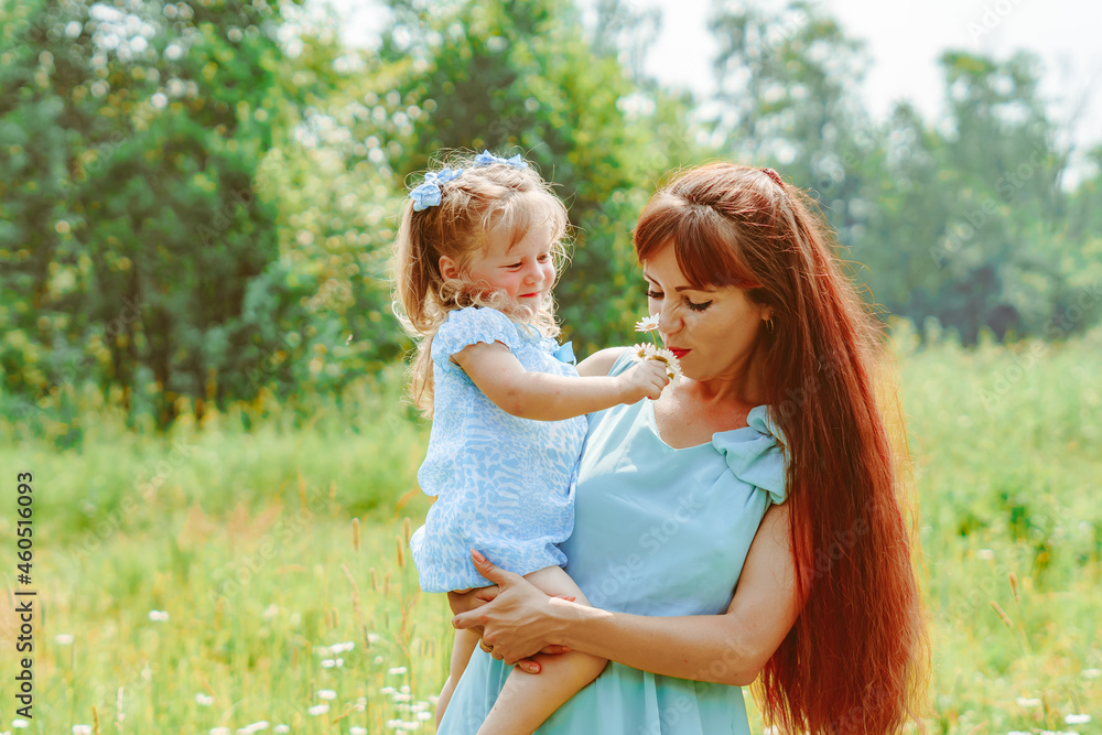 mom hugs her daughter in nature mom hugs her daughter in nature
