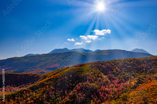 Canvas Print Sun setting over autumn mountains