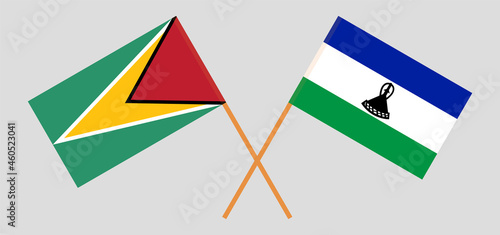 Crossed flags of Guyana and Kingdom of Lesotho. Official colors. Correct proportion