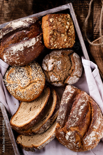 Sliced rye bread on cutting board, closeup..