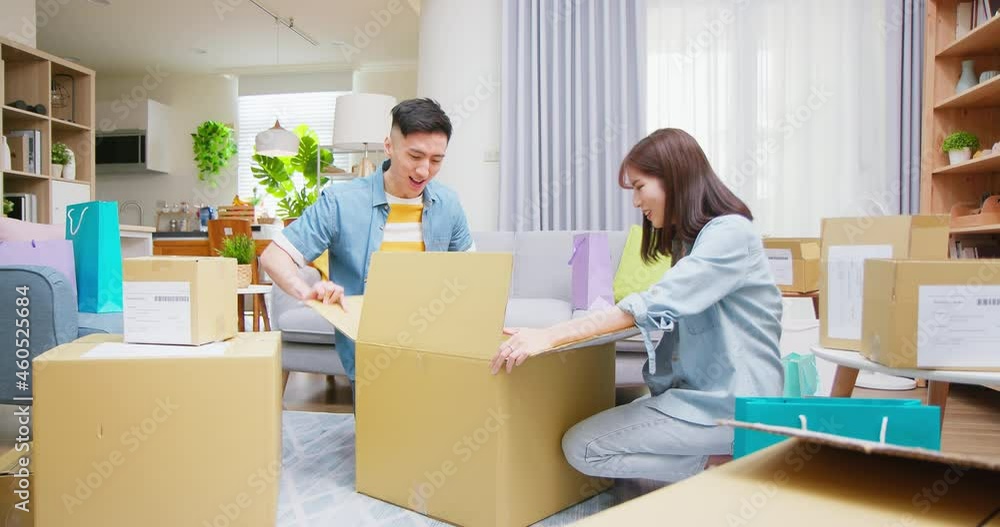 couple open delivery boxes couple open delivery boxes