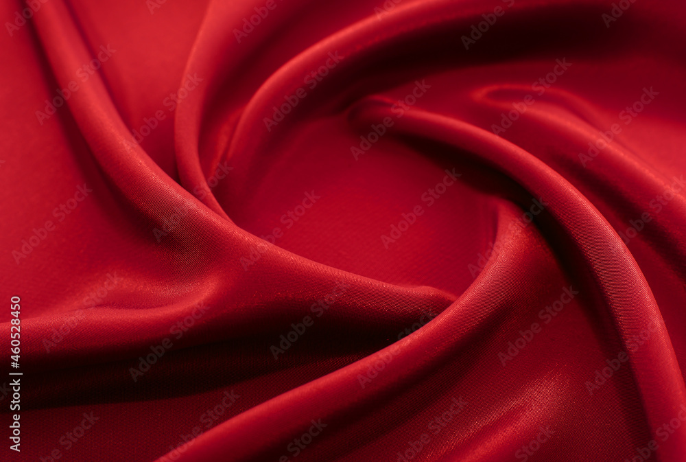 A piece of burgundy, red cloth. Fabric texture for background and design works of art, beautiful wrinkled pattern of silk or linen. A crumpled piece of cloth A piece of burgundy, red cloth. Fabric texture for background and design works of art, beautiful wrinkled pattern of silk or linen. A crumpled piece of cloth