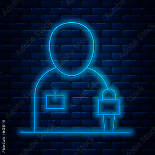 Glowing neon line Journalist news reporter with microphone icon isolated on brick wall background. Vector