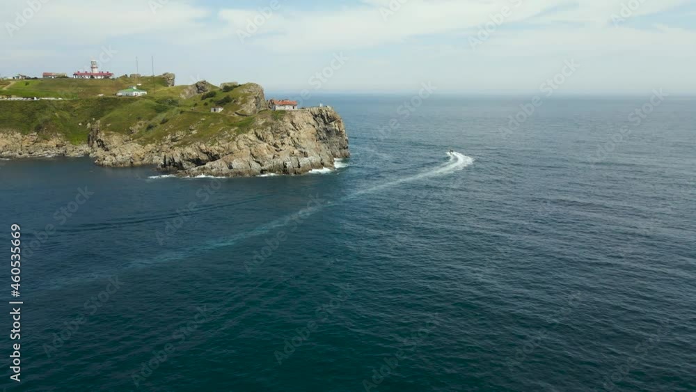 Aerial view of Lighthouse Gamow, boats, above the Pacific Ocean	
