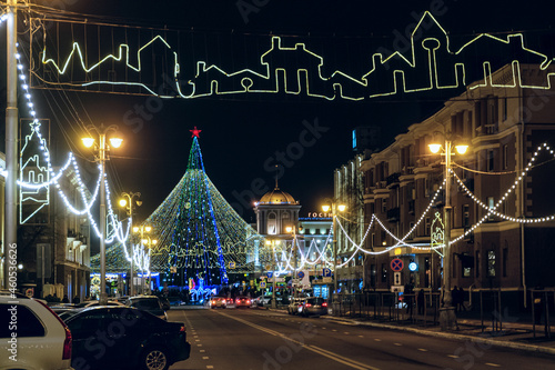 Belgorod, Russia - January 05, 2021: Belgorodsky prospect and Sobornaya (Cathedral) Square with new year decorations and lights fir-tree in Belgorod city. photo