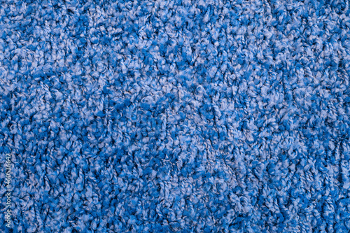 Photography Texture of blue fabric carpet with long pile close-up