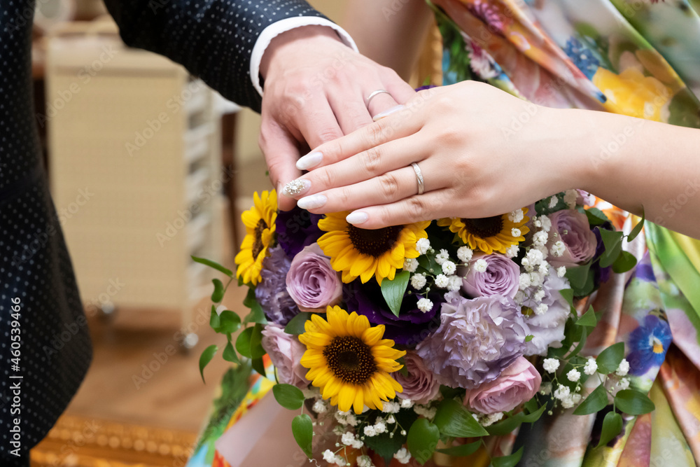 Fototapeta premium bride and groom holding hands