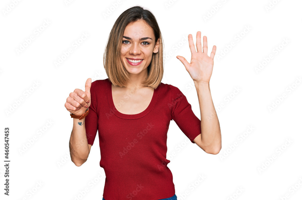 Young blonde girl wearing casual clothes showing and pointing up with fingers number six while smiling confident and happy. Young blonde girl wearing casual clothes showing and pointing up with fingers number six while smiling confident and happy.