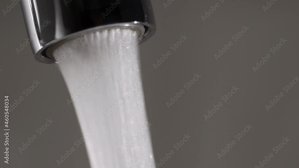 Water flow from the tap. Mixer in the kitchen. Pure clear drinking water. Stock ビデオ Adobe Stock