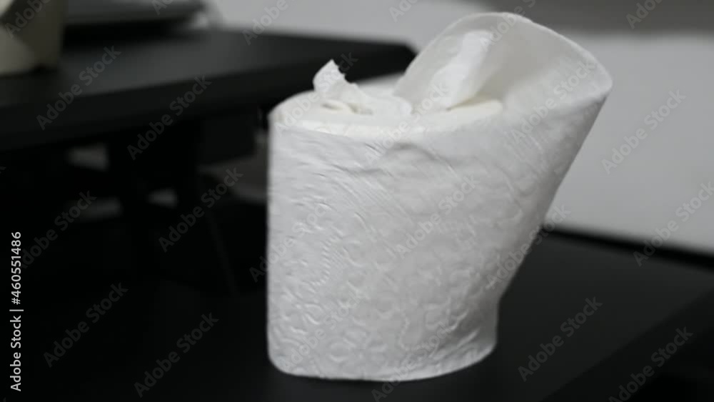 A roll of white color toilet paper. A roll of white color toilet paper.
