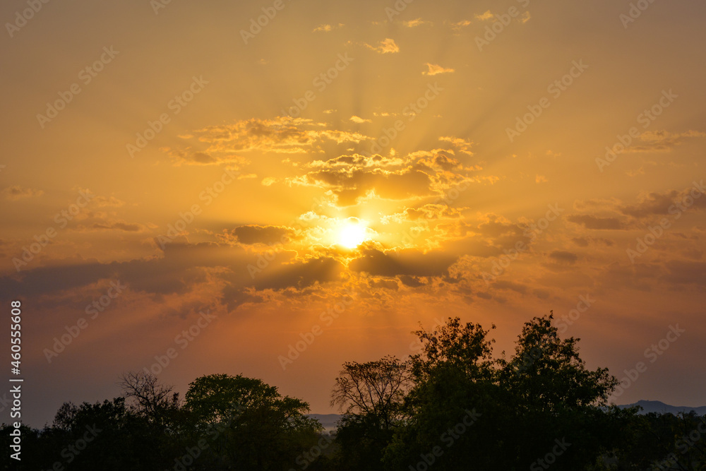 Sunset with sun rays. Amazing summer sunset as a background. Sunset with sun rays. Amazing summer sunset as a background.
