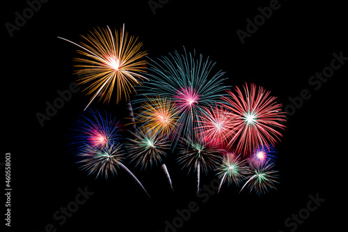 Many flashing colorful fireworks in event amazing with black background celebrate New Year  holiday and festival in night.