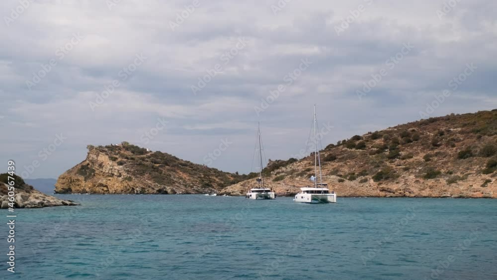 Catamaran sail Yacht anchored on deep blue sea water Catamaran sail Yacht anchored on deep blue sea water