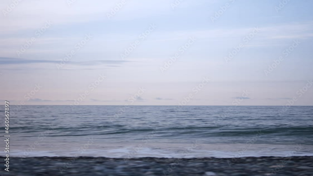 vertical video. Big waves passes in calm ocean along the west coast of Norway. Pebbles small stones. vertical video. Big waves passes in calm ocean along the west coast of Norway. Pebbles small stones.