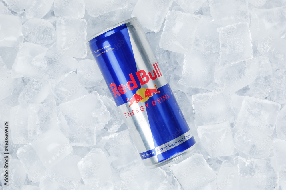 Red Bull Energy Drink lemonade soft drink in can on ice cubes Stock Photo |  Adobe Stock