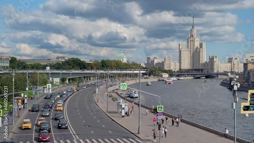 4K. MOSCOW, RUSSIA, August 22, 2021. Moscow river, embankment, go cars, summer day. Pleasure boats sail along the river. View of river in city of Moscow Country Russia