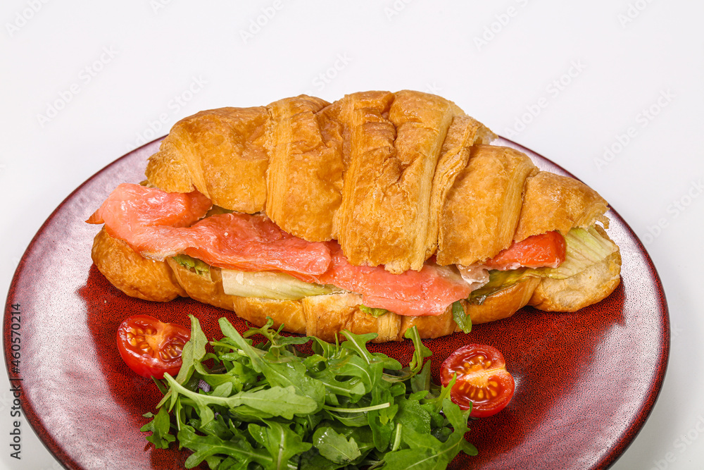 Croissant with salmon for breakfast