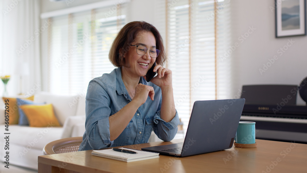 Asia healthy elder people, SME owner lady or latin telesale service agent manager answer cellphone call via 5G wifi wireless relax sit at home office desk with smile humor laugh client care job. Asia healthy elder people, SME owner lady or latin telesale service agent manager answer cellphone call via 5G wifi wireless relax sit at home office desk with smile humor laugh client care job.