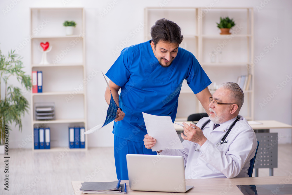 Two male doctors working in the clinic Two male doctors working in the clinic