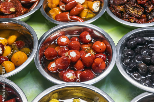 pickled olives with different fillings, pepper stuffed with cheese and other pickled vegetables