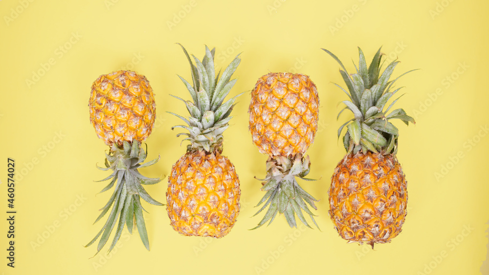 pineapple fruit isolated on a yellow background pineapple fruit isolated on a yellow background