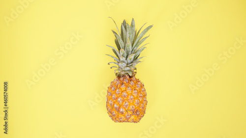 a pineapple isolated on yellow background