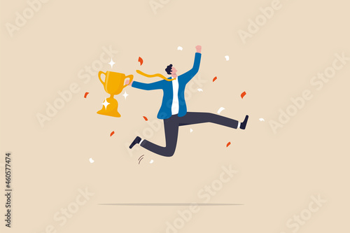 Fotografering Celebrate work achievement, success or victory, winning prize or trophy, challenge or succeed in business competition concept, happy businessman holding winning trophy jumping high for celebration