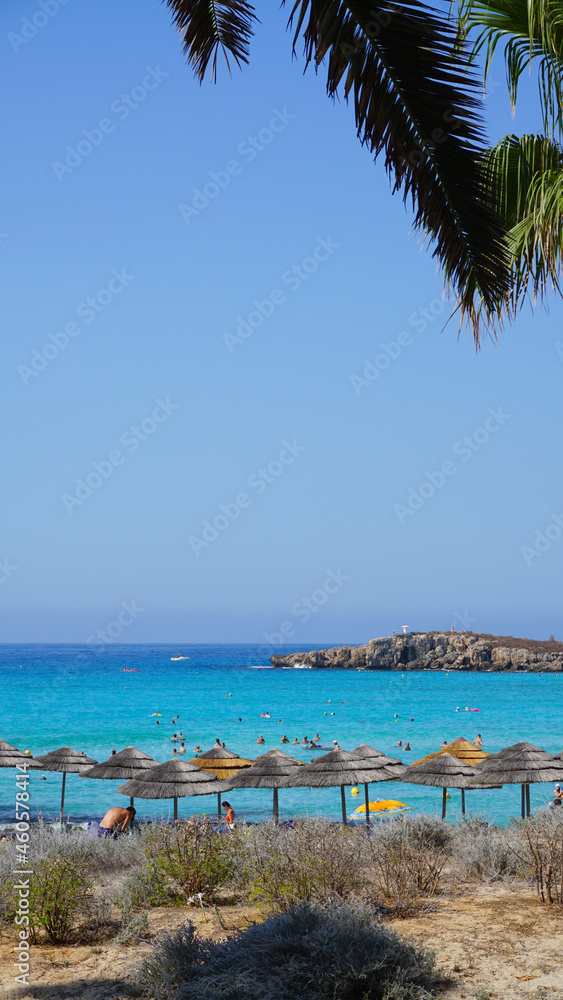 beach sea blue sky sun umbrellas sun beds cyprus beach nissi beach