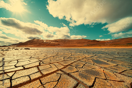 Cracked earth at the site of a dried lake. Global climate change concept