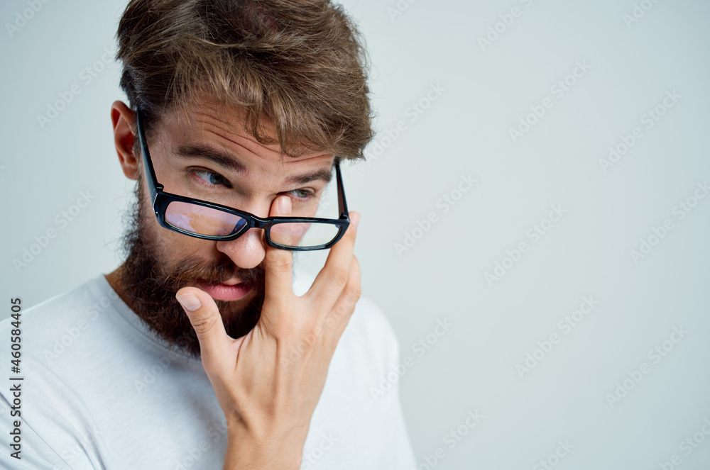 bearded man vision problems in white t-shirt isolated background bearded man vision problems in white t-shirt isolated background