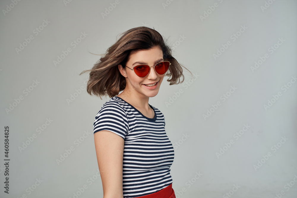 pretty woman in a striped T-shirt posing Studio pretty woman in a striped T-shirt posing Studio