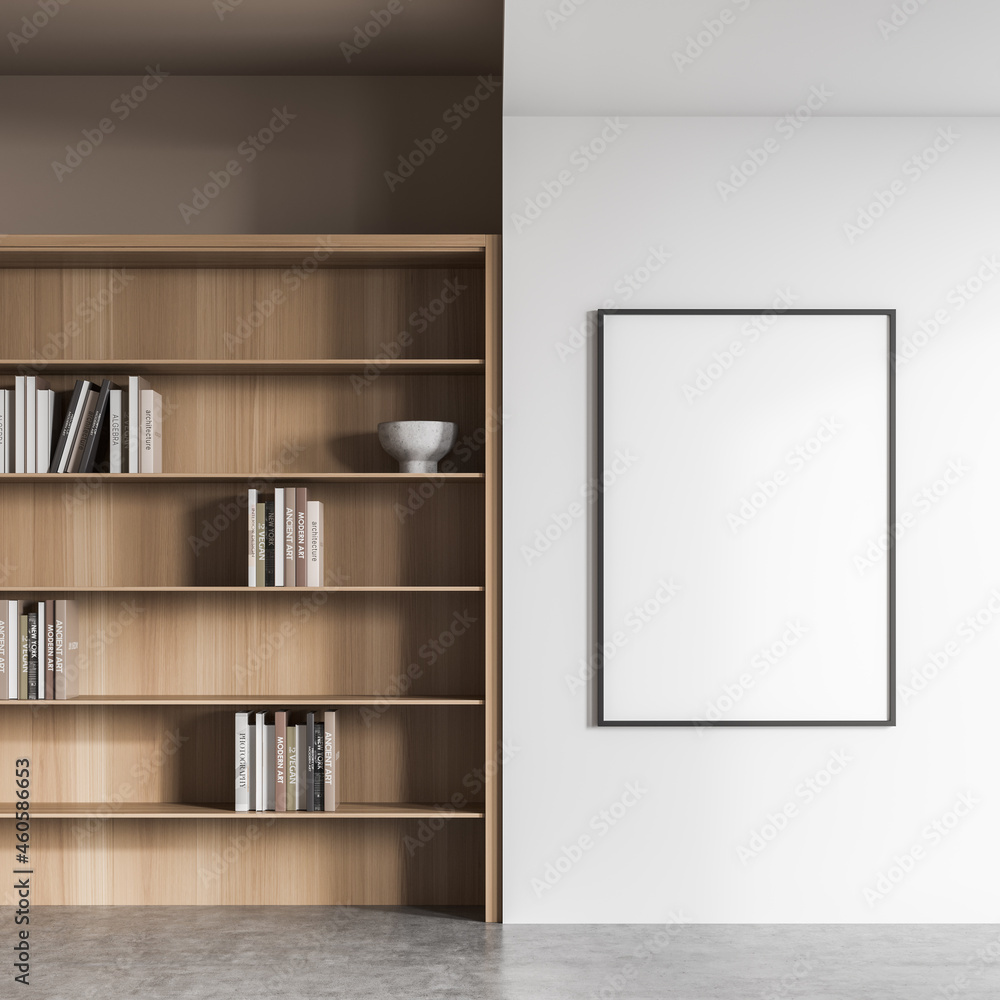 Empty frame on white living room wall with bookcase Empty frame on white living room wall with bookcase