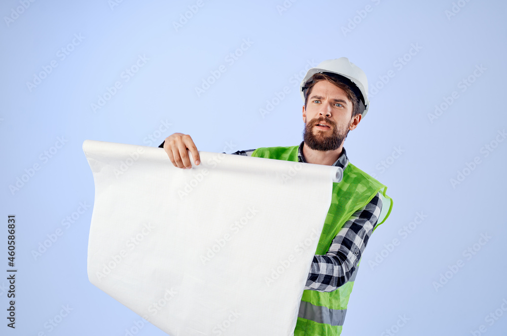 male worker in a white helmet blueprints Professional isolated background male worker in a white helmet blueprints Professional isolated background