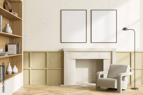 Light living room interior with armchair, bookshelf and mock up posters © ImageFlow