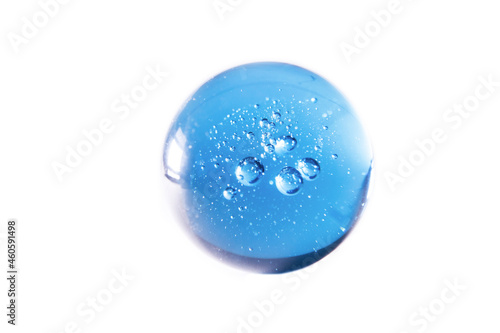 blue glass ball with bubbles against white background