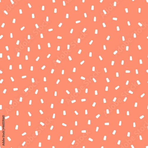 Pink seamless pattern with white sprinkles background.