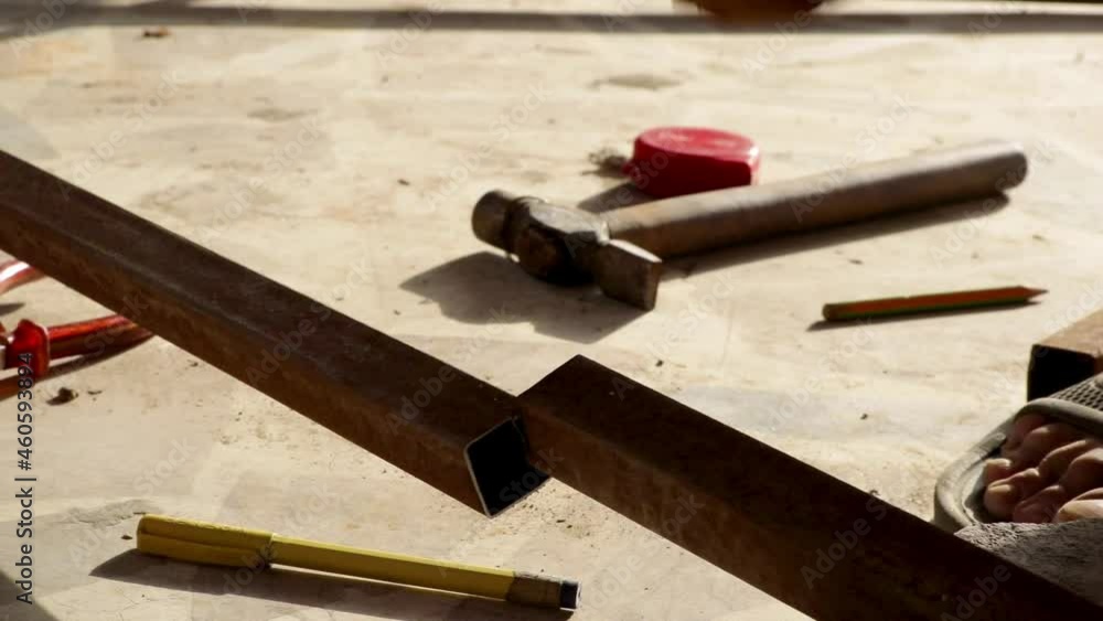 Cutting rustic steel bar with electric cutter. Cutting rustic steel bar with electric cutter.