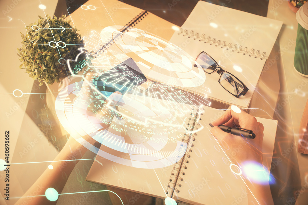 Double exposure of woman on-line shopping holding a credit card and data theme hologram drawing. E-commerce concept. Double exposure of woman on-line shopping holding a credit card and data theme hologram drawing. E-commerce concept.