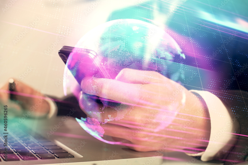 Double exposure of man's hands holding and using a digital device and tech theme hologram drawing. Technology concept. Double exposure of man's hands holding and using a digital device and tech theme hologram drawing. Technology concept.