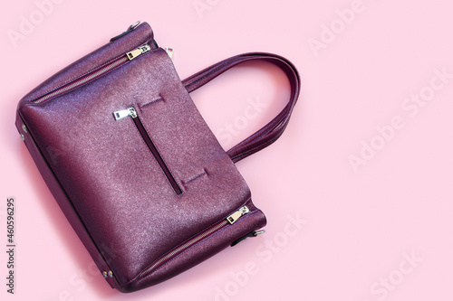 Woman's accessories flat lay on colorful background. Top view purple and pink pastel colors with copy space around products.