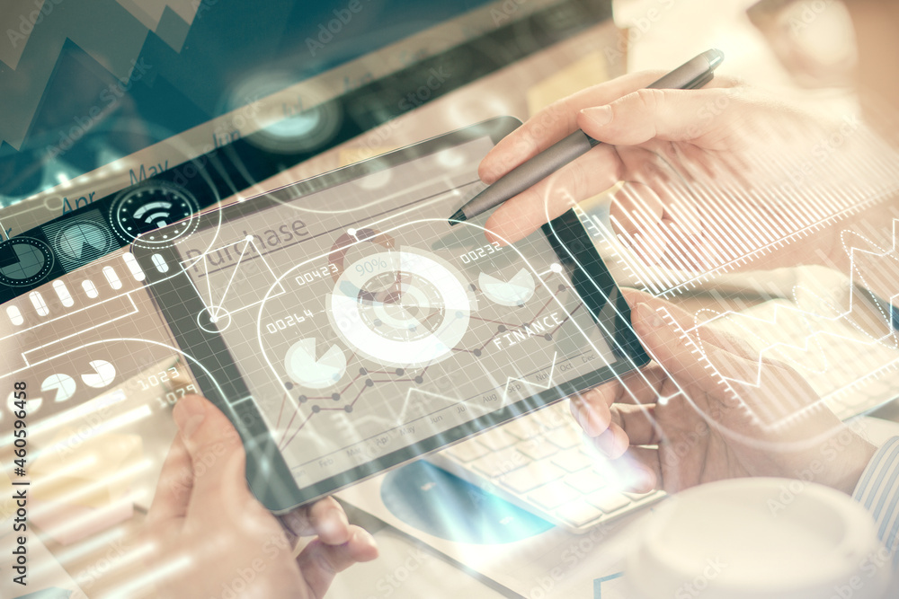 Double exposure of man's hands holding and using a digital device and tech theme hologram drawing. Technology concept. Double exposure of man's hands holding and using a digital device and tech theme hologram drawing. Technology concept.