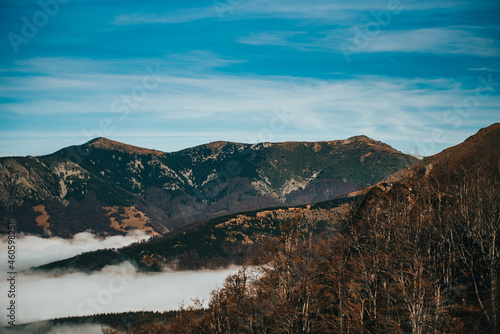 Mountains landscape with a cloud among them